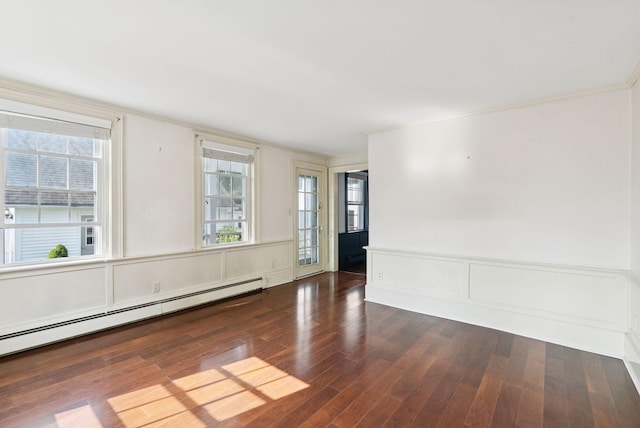 26 Grove St, Bath, ME 04530 - empty room with a decorative wall, a baseboard radiator, wood finished floors, ornamental molding, and plenty of natural light