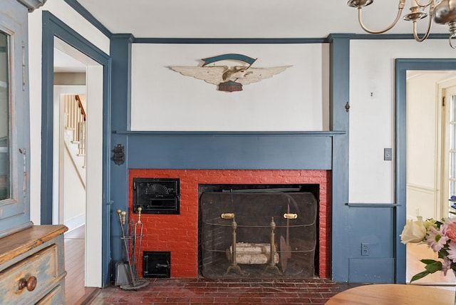 26 Grove St, Bath, ME 04530 - detailed view of a fireplace, ornamental molding, and a chandelier
