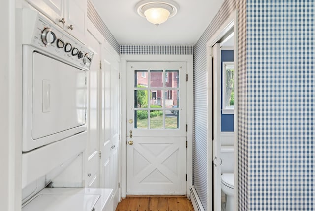 26 Grove St, Bath, ME 04530 - doorway to outside featuring light wood-style flooring, a baseboard heating unit, and wallpapered walls