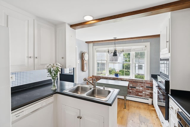 26 Grove St, Bath, ME 04530 - kitchen featuring white appliances, a baseboard radiator, dark countertops, light wood-style flooring, and beamed ceiling
