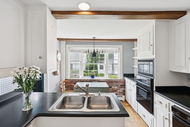 26 Grove St, Bath, ME 04530 - kitchen featuring black appliances, dark countertops, white cabinets, light wood-style flooring, and beamed ceiling