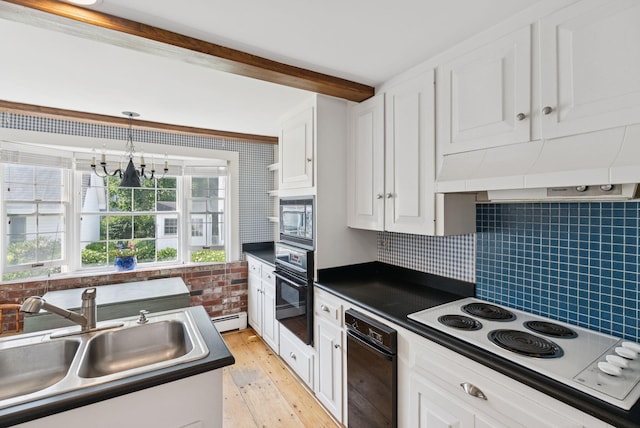 26 Grove St, Bath, ME 04530 - kitchen featuring white electric cooktop, oven, dark countertops, stainless steel microwave, and white cabinets