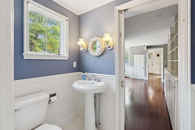 26 Grove St, Bath, ME 04530 - bathroom with wainscoting, healthy amount of natural light, hardwood / wood-style floors, and ornamental molding