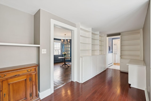 26 Grove St, Bath, ME 04530 - corridor featuring dark wood finished floors, a chandelier, a baseboard radiator, and built in features