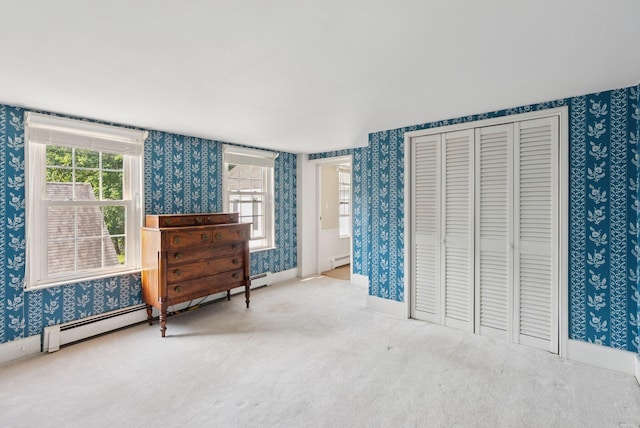 26 Grove St, Bath, ME 04530 - carpeted bedroom with wallpapered walls, a baseboard radiator, and a closet