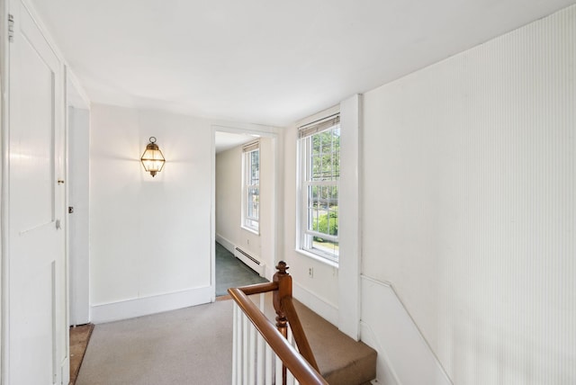 26 Grove St, Bath, ME 04530 - hallway featuring a baseboard heating unit, light carpet, and healthy amount of natural light