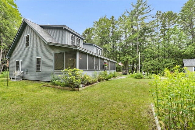 134 Powers Drive Ln, Orland, ME 04472 - view of side of property with a sunroom and a yard