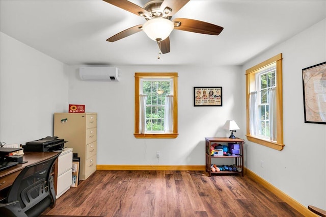 134 Powers Drive Ln, Orland, ME 04472 - home office with a wall unit AC, healthy amount of natural light, wood finished floors, and ceiling fan