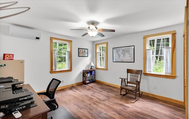 134 Powers Drive Ln, Orland, ME 04472 - office with an AC wall unit, wood finished floors, and a ceiling fan