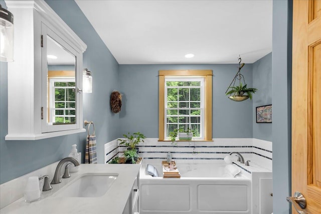134 Powers Drive Ln, Orland, ME 04472 - full bathroom with a garden tub, vanity, and recessed lighting