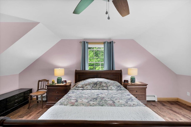 134 Powers Drive Ln, Orland, ME 04472 - bedroom featuring a baseboard heating unit, lofted ceiling, wood finished floors, and a ceiling fan