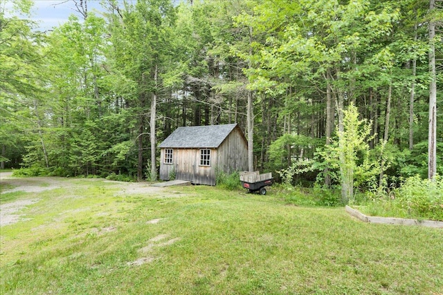 134 Powers Drive Ln, Orland, ME 04472 - view of green lawn with a shed and a view of trees