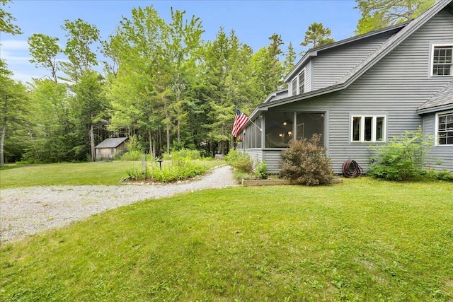 134 Powers Drive Ln, Orland, ME 04472 - view of grassy yard featuring a sunroom and driveway