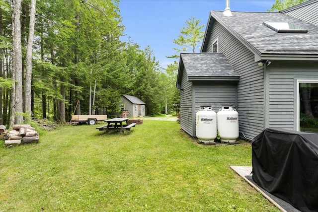 134 Powers Drive Ln, Orland, ME 04472 - view of green lawn featuring a storage unit