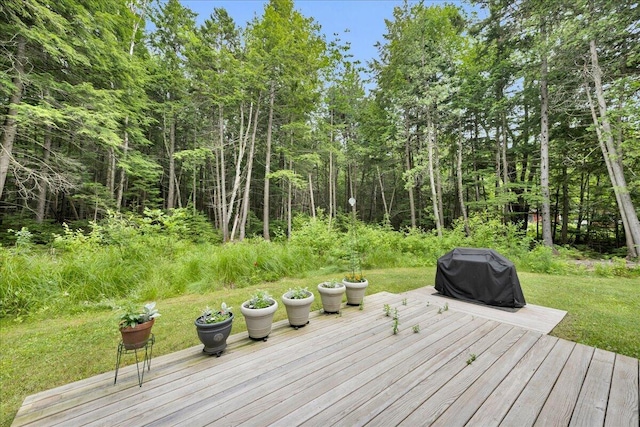 134 Powers Drive Ln, Orland, ME 04472 - wooden terrace featuring area for grilling, a lawn, and a forest view