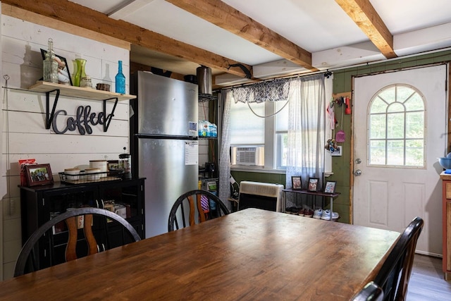 2198 Eight Rod Rd, Sidney, ME 04330 - dining area with cooling unit, beamed ceiling, and wood finished floors