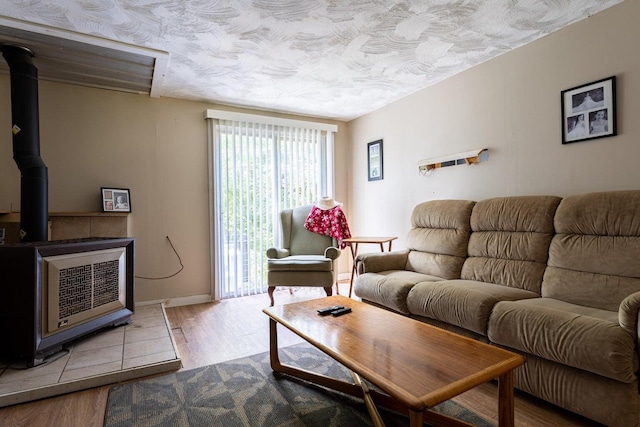 2198 Eight Rod Rd, Sidney, ME 04330 - living area with a wood stove and wood finished floors