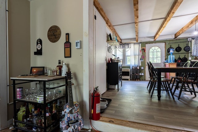 2198 Eight Rod Rd, Sidney, ME 04330 - dining area with wood finished floors and beam ceiling