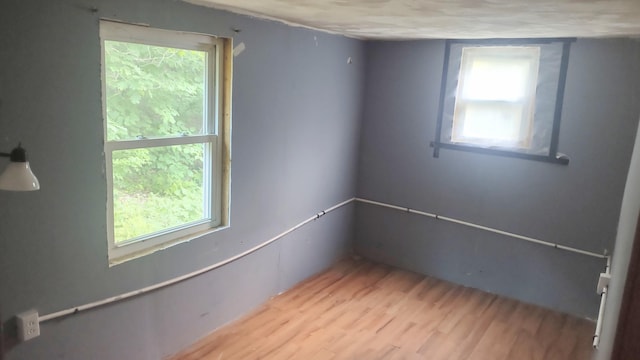 2198 Eight Rod Rd, Sidney, ME 04330 - unfurnished room with wood finished floors and healthy amount of natural light