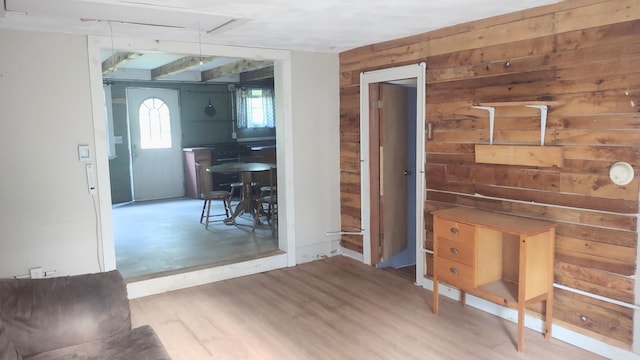 2198 Eight Rod Rd, Sidney, ME 04330 - living room with wood walls, attic access, and wood finished floors