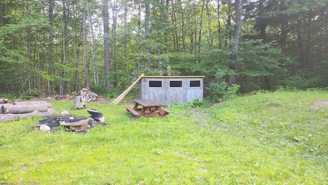 2198 Eight Rod Rd, Sidney, ME 04330 - view of yard featuring a forest view and a fire pit