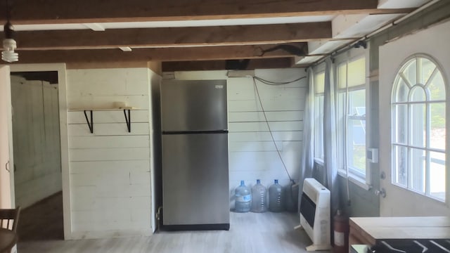 2198 Eight Rod Rd, Sidney, ME 04330 - basement featuring freestanding refrigerator, wood finished floors, and heating unit