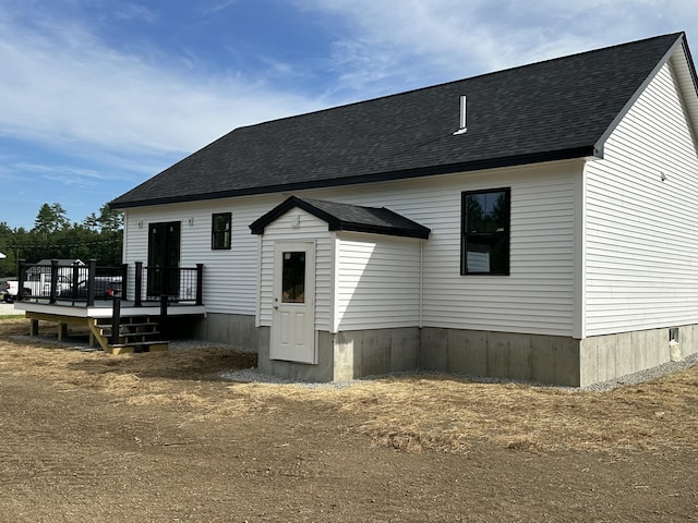 17 Emmas Way, Limerick, ME 04048 - back of property with a wooden deck and a shingled roof
