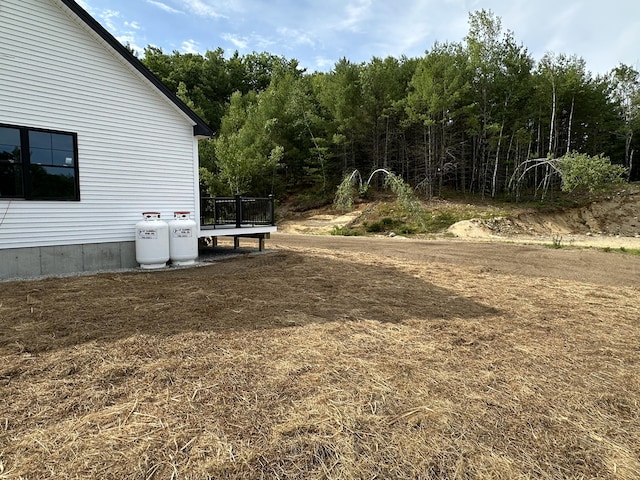 17 Emmas Way, Limerick, ME 04048 - view of yard with a deck and a view of trees