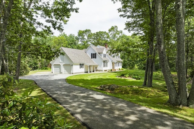 35 Rice Rd, Boothbay, ME 04544 - new england style home with driveway, a front lawn, a chimney, and view of scattered trees