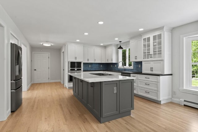 35 Rice Rd, Boothbay, ME 04544 - kitchen with black appliances, white cabinets, plenty of natural light, backsplash, and recessed lighting