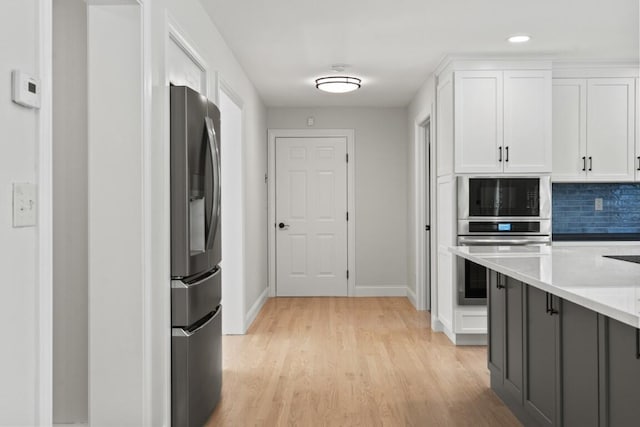 35 Rice Rd, Boothbay, ME 04544 - kitchen featuring appliances with stainless steel finishes, white cabinets, light countertops, light wood-type flooring, and recessed lighting