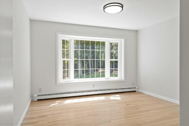35 Rice Rd, Boothbay, ME 04544 - spare room featuring a baseboard heating unit and wood finished floors