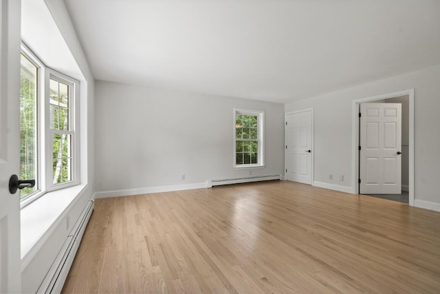 35 Rice Rd, Boothbay, ME 04544 - unfurnished room with a baseboard heating unit, baseboard heating, plenty of natural light, and light wood finished floors