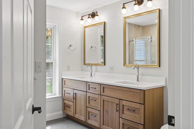 35 Rice Rd, Boothbay, ME 04544 - full bath featuring double vanity, a shower with door, and tile patterned flooring