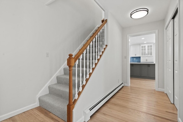 35 Rice Rd, Boothbay, ME 04544 - stairway featuring baseboard heating and wood finished floors