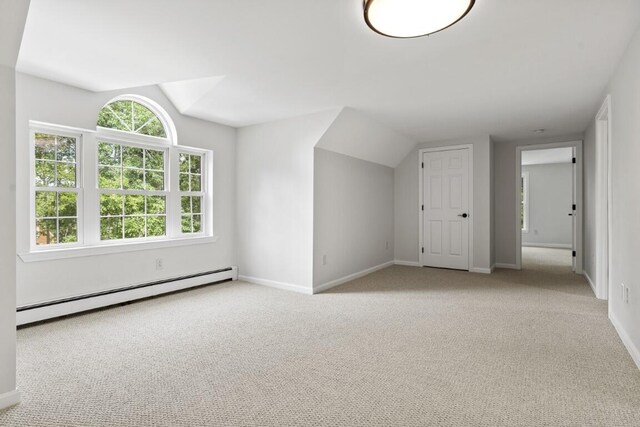 35 Rice Rd, Boothbay, ME 04544 - bonus room featuring a baseboard radiator, vaulted ceiling, and light colored carpet