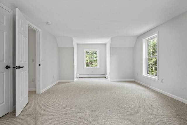 35 Rice Rd, Boothbay, ME 04544 - empty room featuring light carpet, baseboard heating, vaulted ceiling, and a smoke detector
