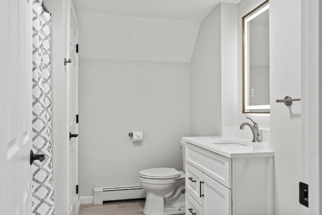35 Rice Rd, Boothbay, ME 04544 - full bathroom with a baseboard radiator, vanity, and wood finished floors