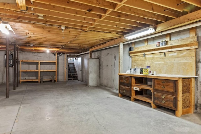 35 Rice Rd, Boothbay, ME 04544 - unfinished basement featuring stairway and a workshop area
