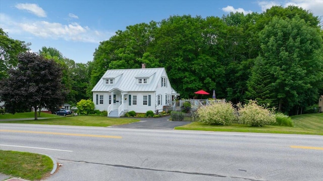 278 S Main St, Auburn, ME 04210 - view of front of property featuring a chimney, a metal roof, and a standing seam roof
