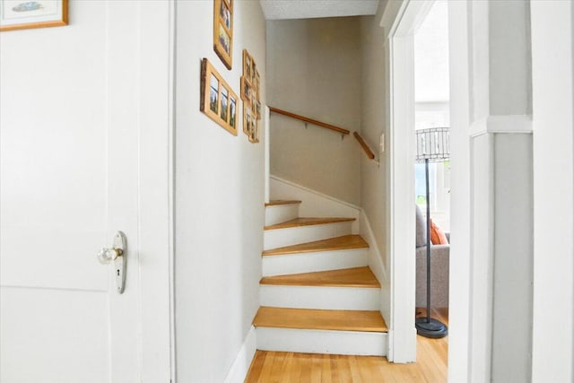 278 S Main St, Auburn, ME 04210 - stairs featuring wood finished floors and baseboards
