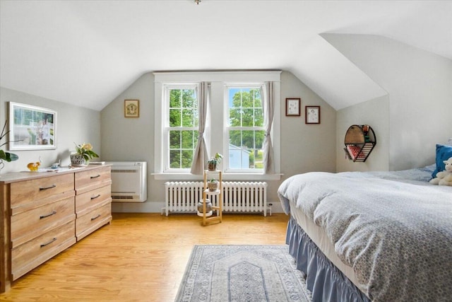 278 S Main St, Auburn, ME 04210 - bedroom featuring radiator heating unit, lofted ceiling, and light wood-style flooring