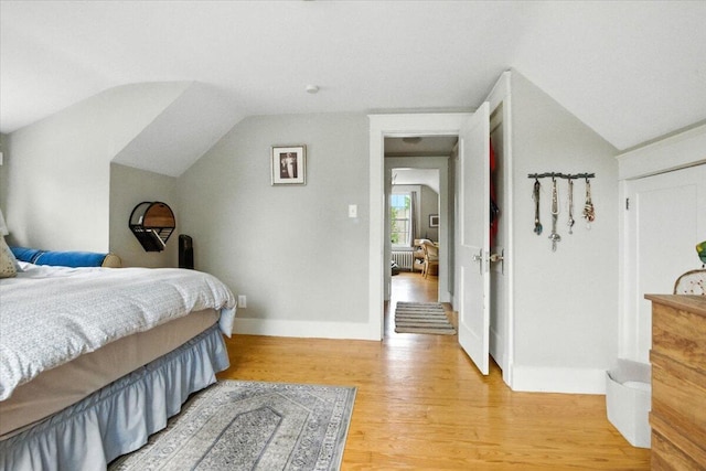 278 S Main St, Auburn, ME 04210 - bedroom with vaulted ceiling and light wood-type flooring