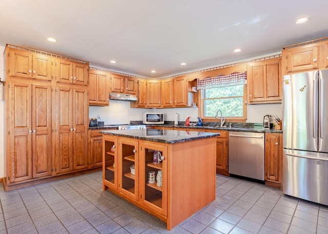 103 Hardscrabble Rd, Hollis, ME 04042 - kitchen featuring appliances with stainless steel finishes, under cabinet range hood, light tile patterned floors, recessed lighting, and a center island