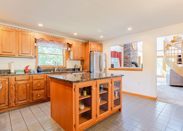 103 Hardscrabble Rd, Hollis, ME 04042 - kitchen featuring freestanding refrigerator, dark stone counters, recessed lighting, a center island, and glass insert cabinets
