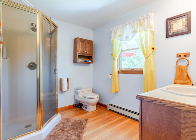 103 Hardscrabble Rd, Hollis, ME 04042 - bathroom featuring a baseboard radiator, wood finished floors, and a shower stall