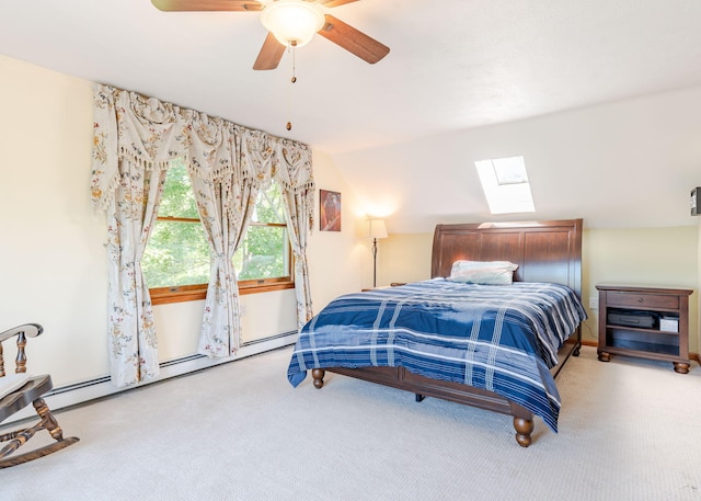 103 Hardscrabble Rd, Hollis, ME 04042 - bedroom with light colored carpet, a skylight, a baseboard radiator, ceiling fan, and lofted ceiling