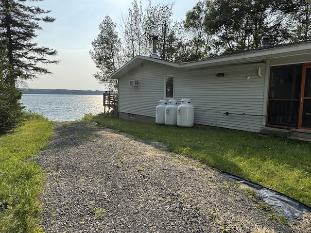 157 Cyr Rd, Cross Lake Twp, ME 04779 - view of property exterior with a water view and an AC wall unit