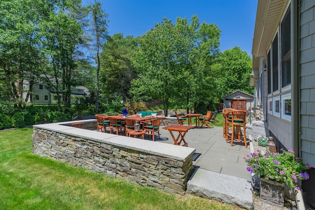 250 Mere Point Rd, Brunswick, ME 04011 - view of patio featuring outdoor dining space and view of scattered trees