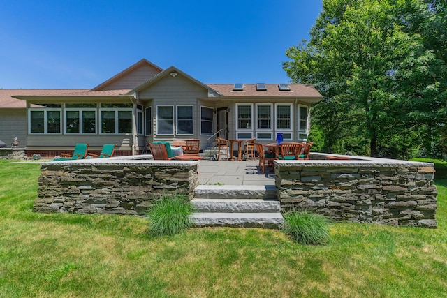 250 Mere Point Rd, Brunswick, ME 04011 - back of property with a patio area, a yard, a sunroom, and roof with shingles
